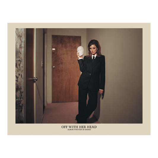 A poster featuring BANKS in a suit holding a mask, standing in a doorway. The text on the poster reads 'OFF WITH HER HEAD'.
